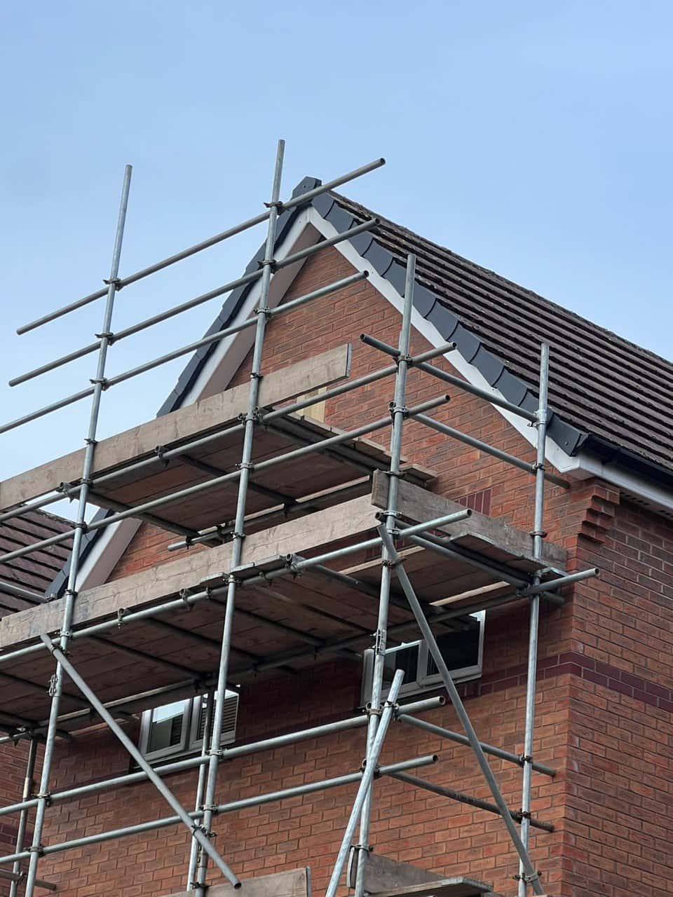 This is a photo of a roof which has just been repaired. There is a scaffold located at the gable end for access onto the roof. Works carried out by Lee-on-the-Solent Roofing Repairs